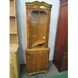 Yew wood corner cabinet with glass door above cupboard. 63 x 41 x 183cms. Estimate £20-30.