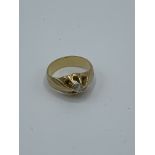 Yellow metal and diamond ring, size J, weight 5.2gms. Estimate £150-180.