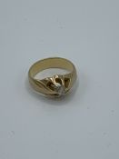 Yellow metal and diamond ring, size J, weight 5.2gms. Estimate £150-180.