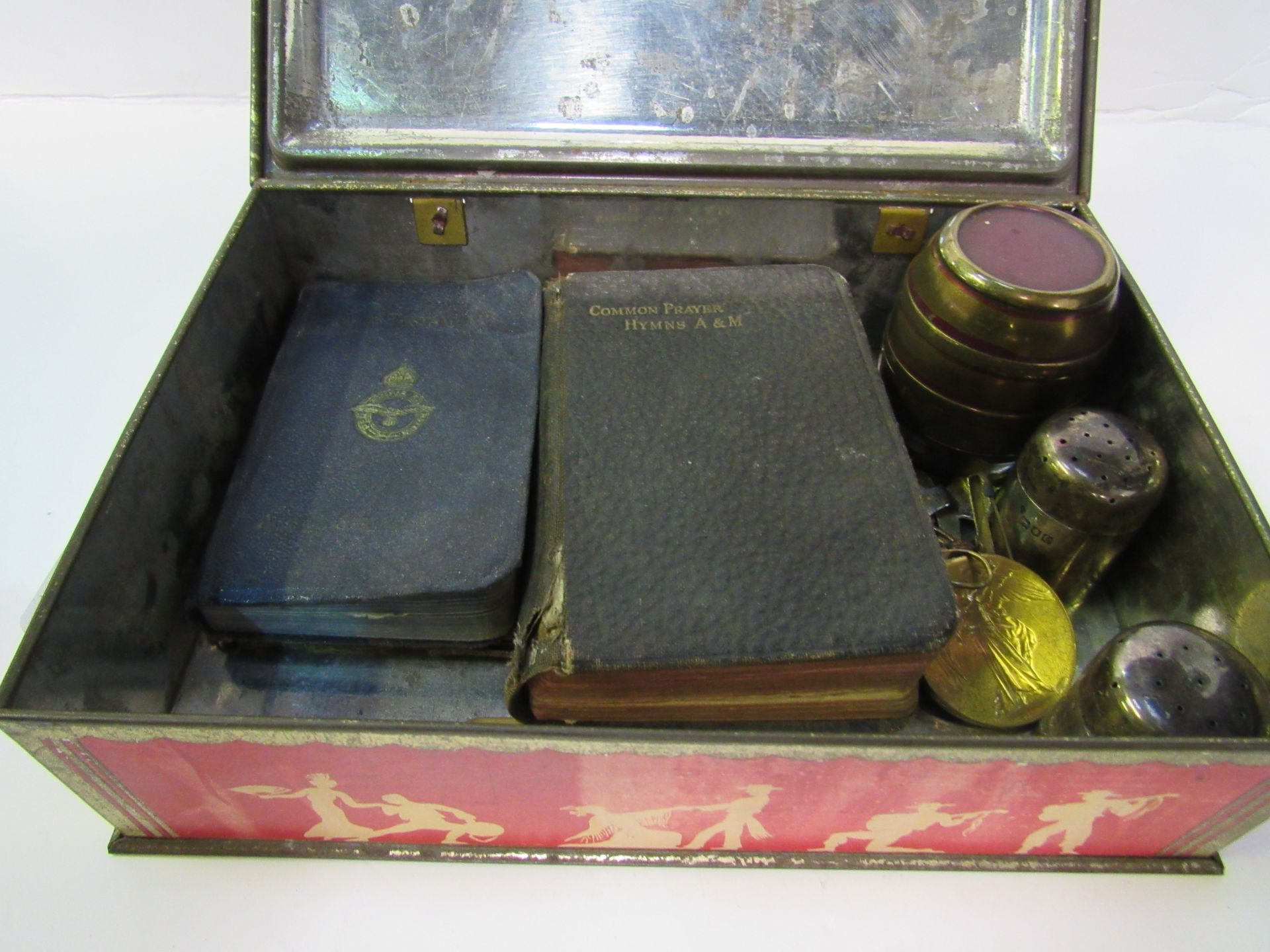 Tin containing an Oddfellows Society sash; Great War 1914-1919 medal; 2 Royal Artillery badges and