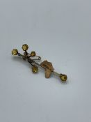 9ct gold ""Africa"" brooch. Estimate £30-40.