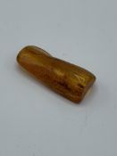 A piece of insect amber, weight 6.6gms. Estimate £20-40.