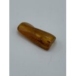 A piece of insect amber, weight 6.6gms. Estimate £20-40.