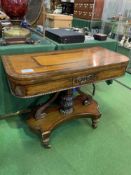 Mahogany inlaid fold-over top card table on single pedestal with scrolled supports to 4 legs on