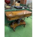 Mahogany inlaid fold-over top card table on single pedestal with scrolled supports to 4 legs on