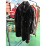 Dynathink simulated long dark brown fur coat. Estimate 20-40.