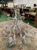 Large white painted metal chandelier. Height 117cms. Diameter 134cms. Estimate £50-70.