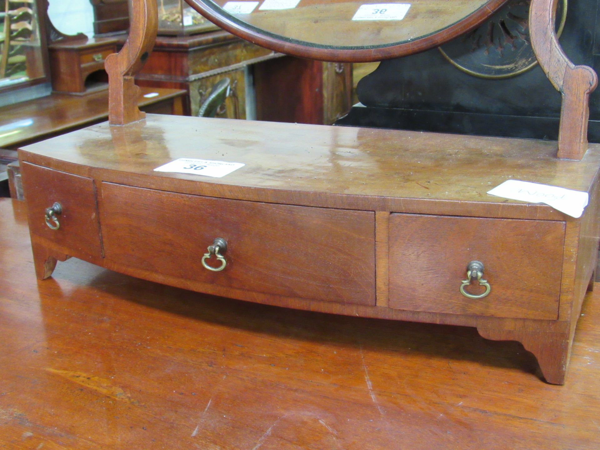 Walnut toilet mirror on shaped supports and three frieze drawers. Estimate £20-30. - Image 2 of 2