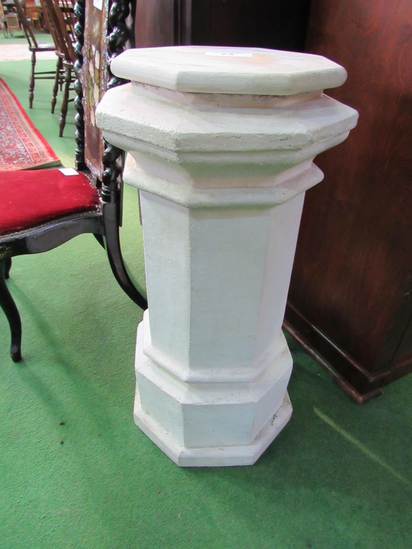 White painted concrete octagonal pedestal. Height 72cms. Estimate £20-40.