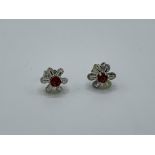 White metal ruby and yellow diamond earrings, weight 2.2gms. Estimate £350-380.