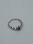 9ct white gold with blue stone & diamonds either side, size O, weight 1.4gms Estimate £30-40