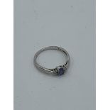 9ct white gold with blue stone & diamonds either side, size O, weight 1.4gms Estimate £30-40