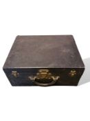 Louis Vuitton fitted dressing case, black textured leather exterior with brass lock and catches.