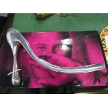 Manolo Blahnik white metal shoe horn. Estimate £30-40.