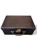 Goyard black textured leather fitted dressing case with 7 original silver topped jars and bottles,