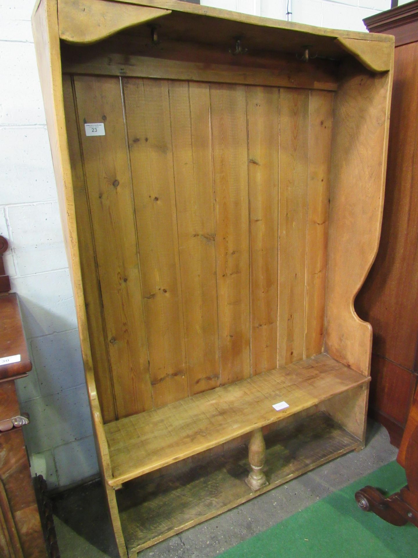 Pine settle converted to coat and boot storage, 129 x 31 x 186cms. Estimate £50-80.