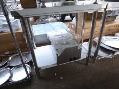90cm new stainless table with shelf. Estimate £80-85.