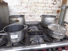 4 heavy duty cook pans. Estimate £40-50.