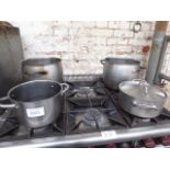 4 heavy duty cook pans. Estimate £40-50.