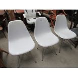 3 white modular chairs.