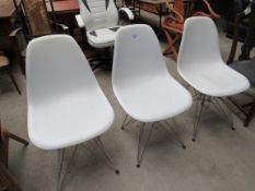 3 white modular chairs.