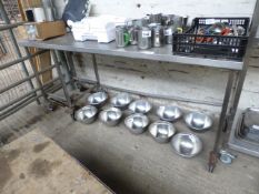 Large mobile stainless steel prep table. Estimate £70-75.