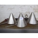 Three large conical strainers. Estimate £15-20.