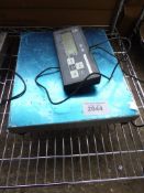 Digital weighing scales. Estimate £30-35.