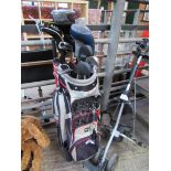 Golf clubs, bag and trolley.