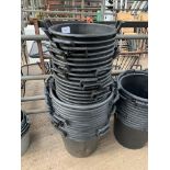 Quantity of large black planters.