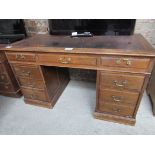 Oak leather top pedestal desk.