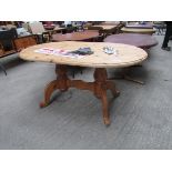 Pine oval shaped kitchen table.