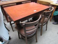 Extending dining table and 4 chairs.