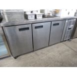 Stainless steel 3 door counter fridge. Estimate £200-225.