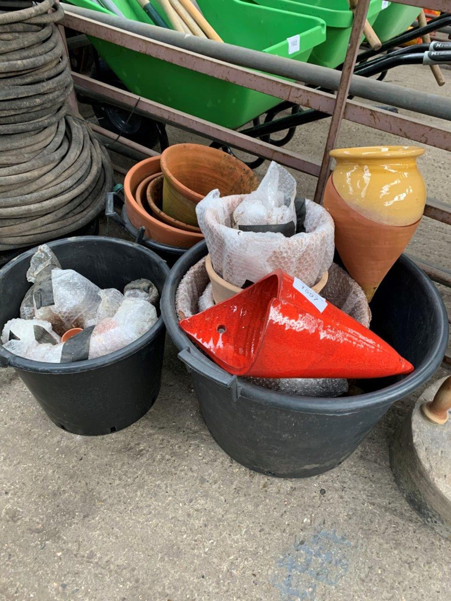 Quantity of glazed flower pots and wall pots.