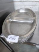 8 large stainless steel vegetable dishes. Estimate £30-40.