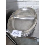 8 large stainless steel vegetable dishes. Estimate £30-40.