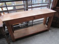 Oak sideboard with frieze drawer and under shelf.