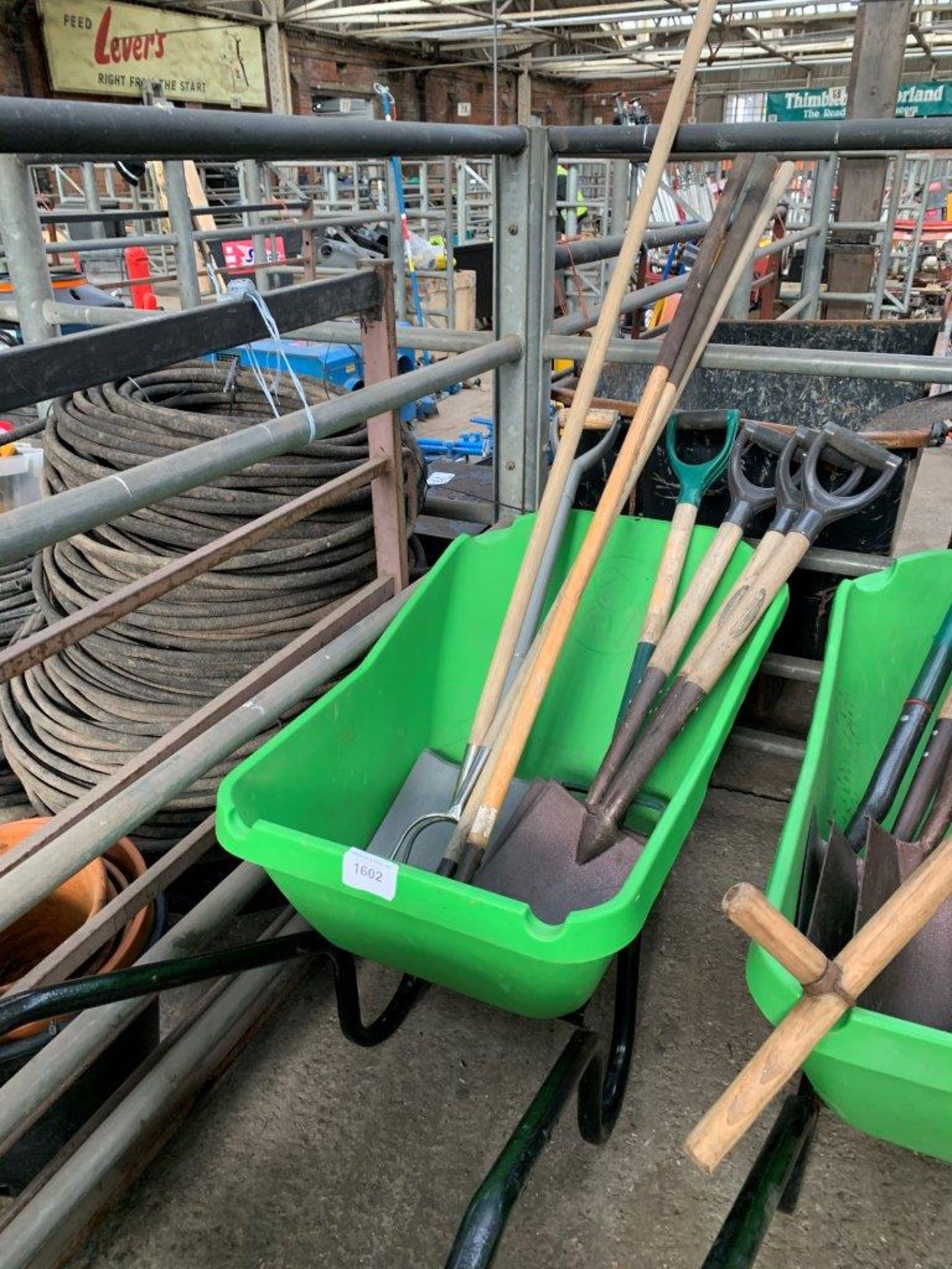 Haemmerlin wheelbarrow together with a quantity of garden tools.