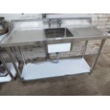 150cm stainless steel sink with taps and shelf. Estimate £180-190.