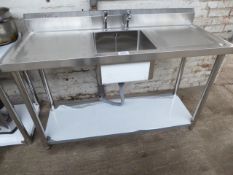 150cm stainless steel sink with taps and shelf. Estimate £180-190.