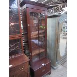 Mahogany glass fronted bookcase.