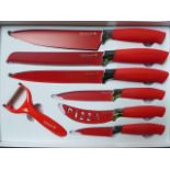 Waltmann 7 piece knife set in red. Estimate £15-20.
