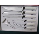 Waltmann 7 piece knife set in white. Estimate £15-20.