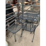 Black painted metal circular garden table complete with 4 chairs; together with a garden bench.