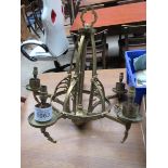 Brass 5 branch chandelier with shades.