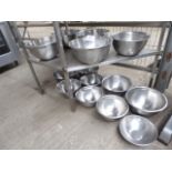 14 stainless steel bowls. Estimate £20-30.
