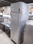 Stainless steel upright fridge. Estimate £100-125