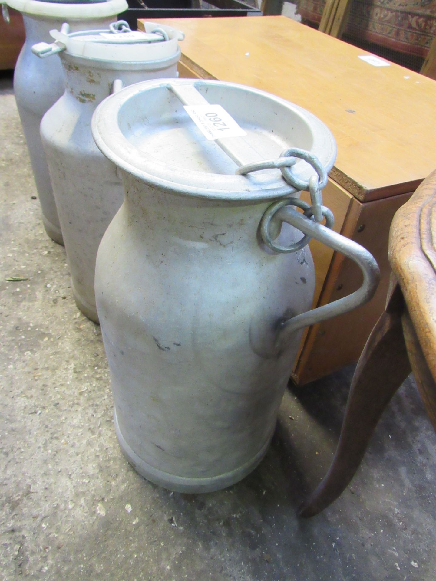 Milk churn with lid.