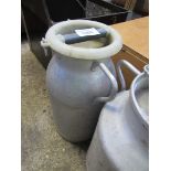 Milk churn with lid.